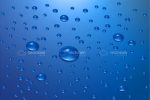 Transparent Water Drops on Blue Background